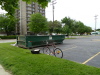 Parking lot at S. Hamilton and W. Michigan, dumpster by the Ypsi Pride folks