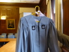 A Collegiate Cap and Gown Columbia Robe, with the crowns on small patches attached to the gown