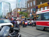 The TTC guy tried to get people to get off the tracks so the streetcar could go by, but gave up